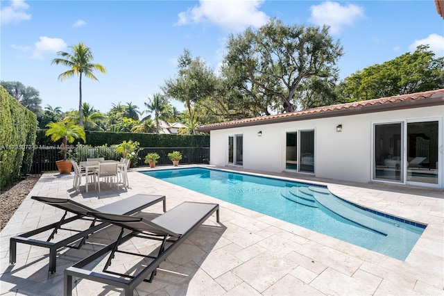 view of pool featuring a patio area