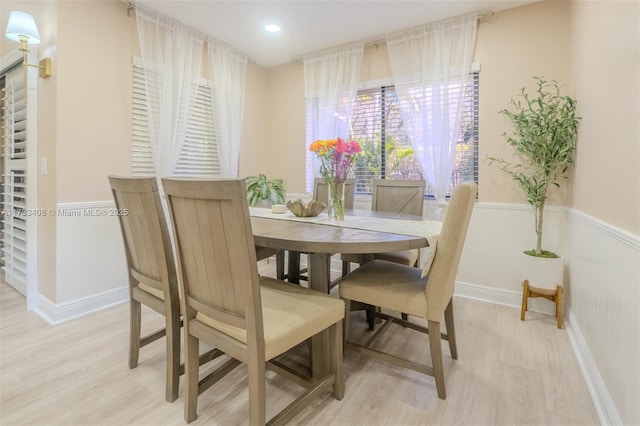 dining space featuring light wood-type flooring