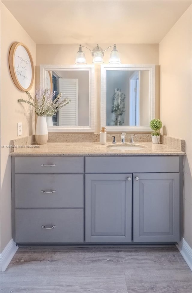 bathroom featuring vanity and hardwood / wood-style floors