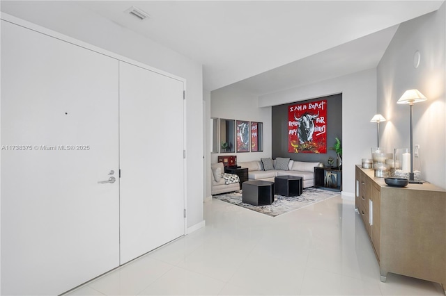 living room with visible vents and baseboards