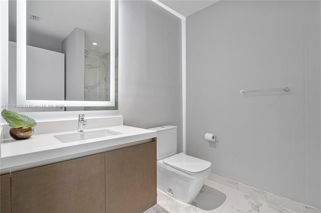 full bath featuring toilet, visible vents, vanity, baseboards, and marble finish floor