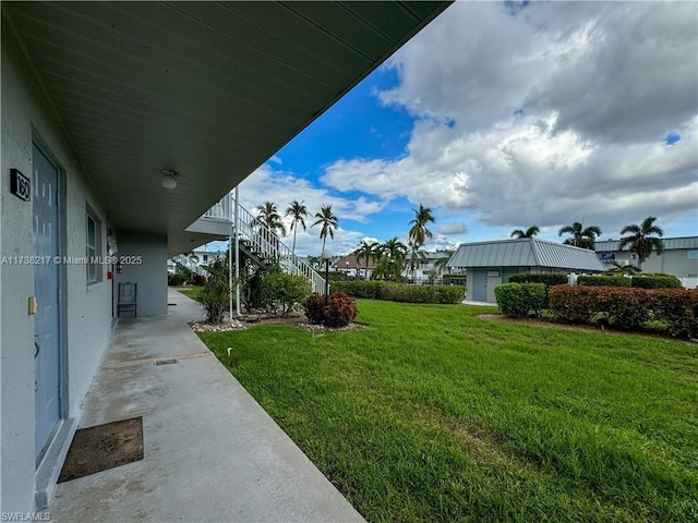 6777 Winkler Rd Unit A160, Fort Myers, FL 33919 - view of green lawn featuring stairs