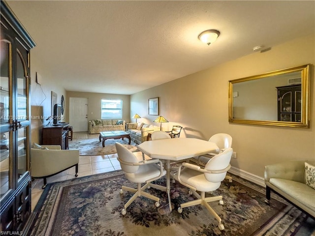 dining area featuring tile patterned flooring