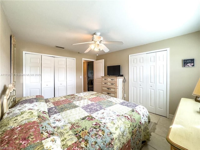 6777 Winkler Rd Unit A160, Fort Myers, FL 33919 - bedroom with light tile patterned floors, multiple closets, and a ceiling fan