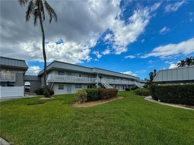 6777 Winkler Rd Unit A160, Fort Myers, FL 33919 - back of property with stairway and a lawn
