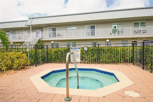 view of pool featuring a hot tub