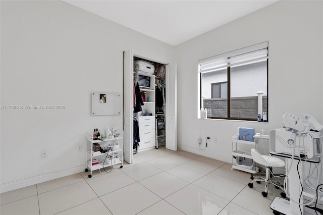 home office featuring light tile patterned flooring