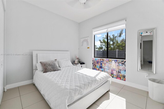 bedroom featuring light tile patterned floors