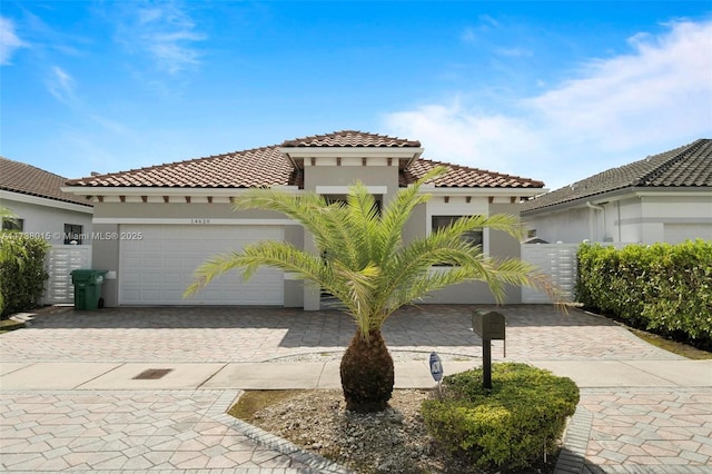 mediterranean / spanish home featuring a garage