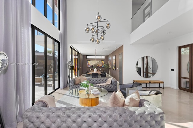 interior space with a towering ceiling and a notable chandelier