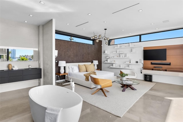 living room featuring a wealth of natural light and a chandelier