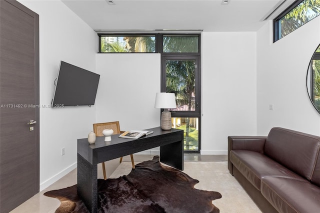 office area featuring floor to ceiling windows