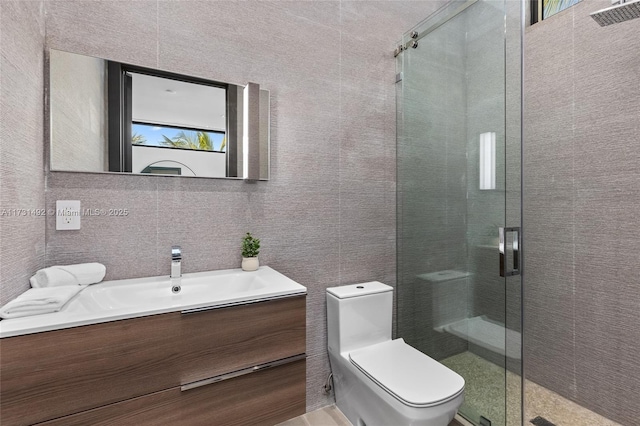 bathroom featuring vanity, an enclosed shower, tile walls, and toilet