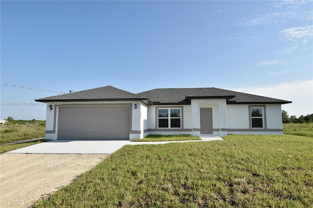 view of front of property featuring a garage and a front lawn