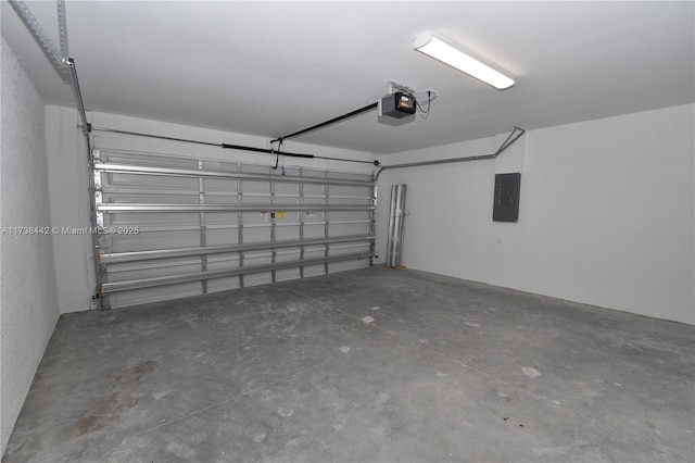 garage featuring a garage door opener and electric panel