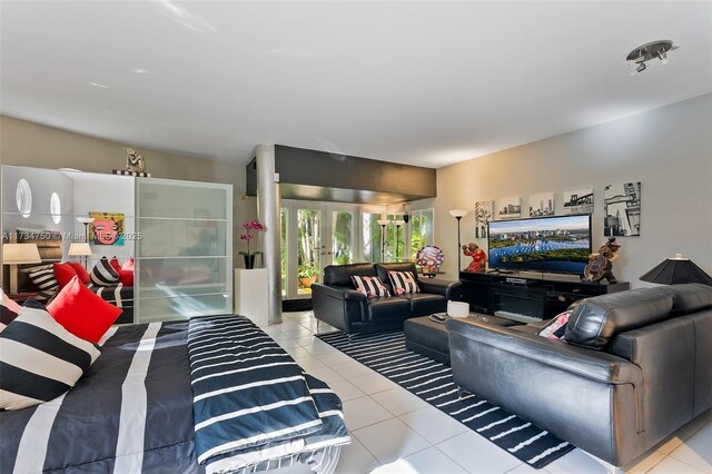 living room with light tile patterned floors and french doors