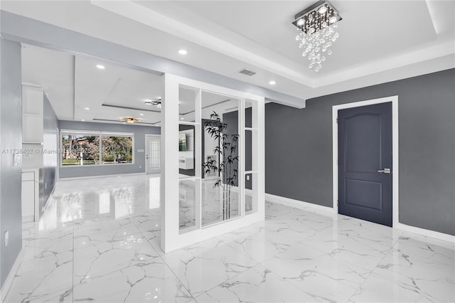 interior space featuring french doors and a tray ceiling