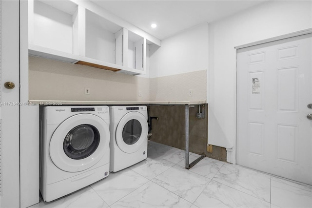 clothes washing area featuring washing machine and dryer