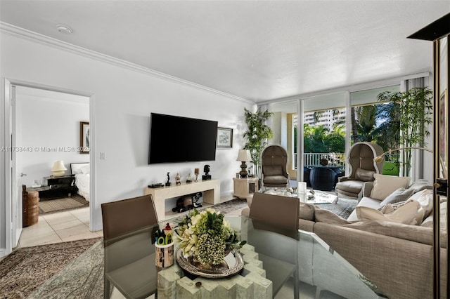 tiled living room with ornamental molding and floor to ceiling windows