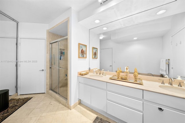 bathroom featuring vanity and a shower with shower door