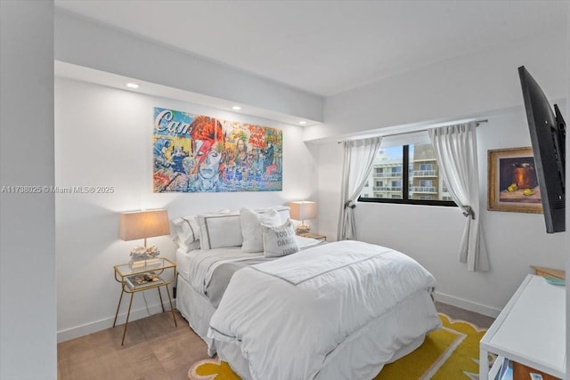 bedroom with light hardwood / wood-style floors