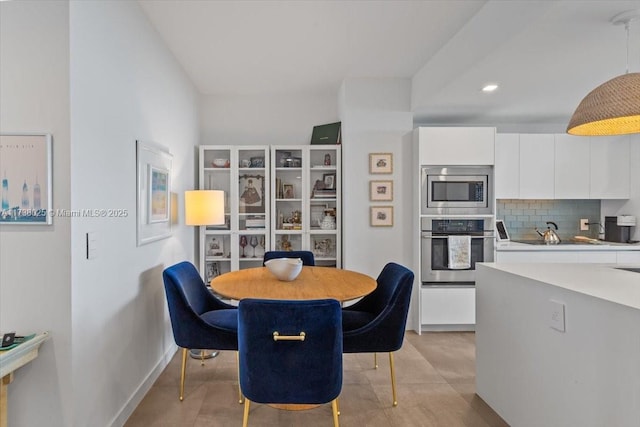 dining space featuring light tile patterned flooring