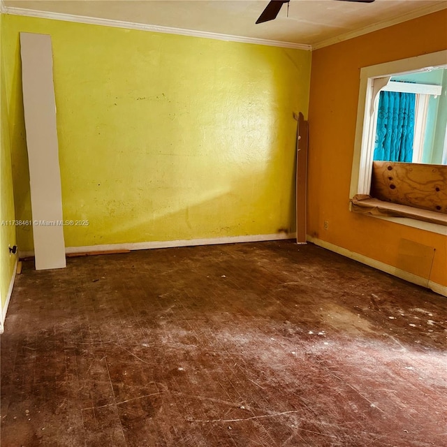 spare room with crown molding and ceiling fan