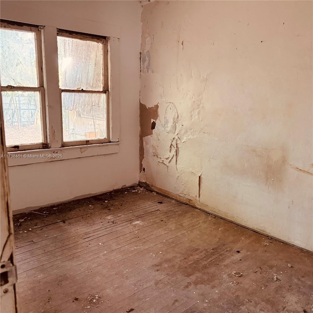 spare room featuring hardwood / wood-style floors