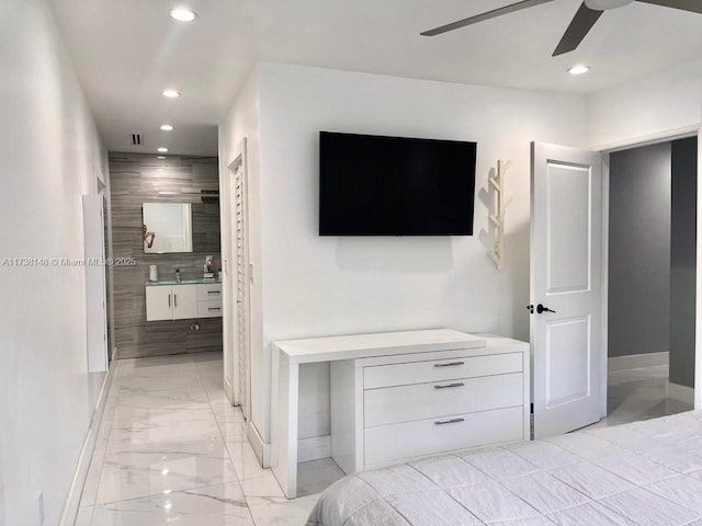 bedroom with ceiling fan and ensuite bathroom