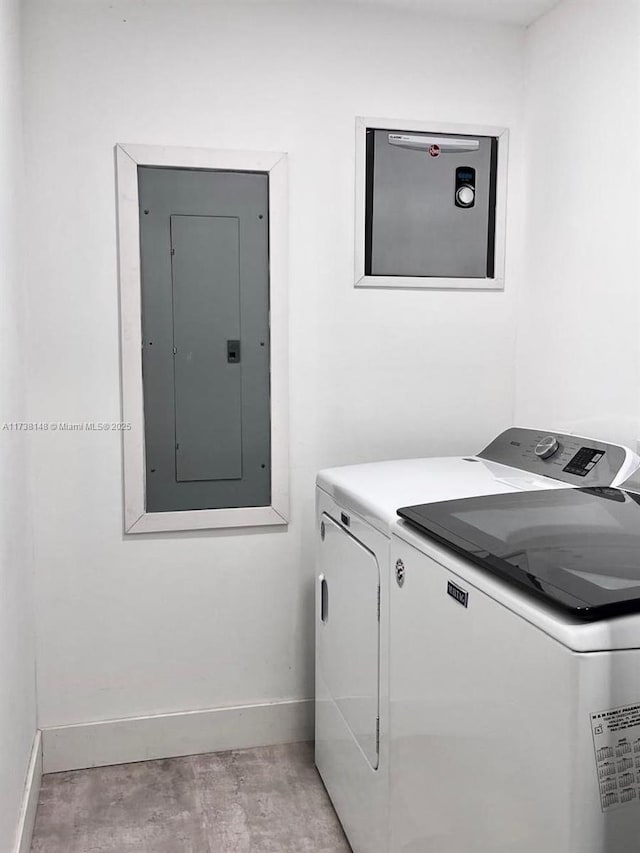 laundry room featuring separate washer and dryer and electric panel