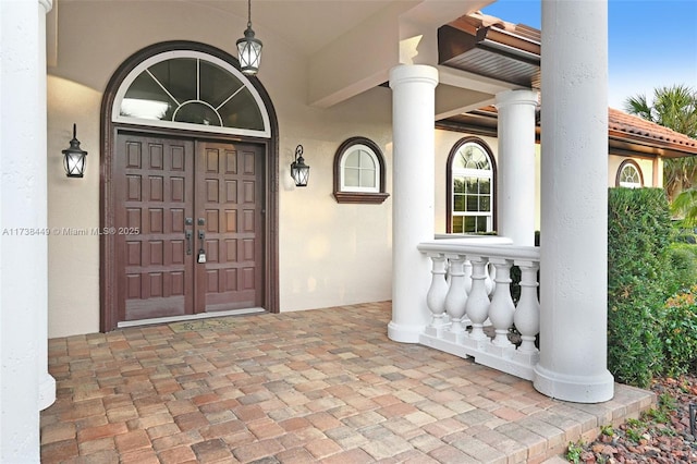doorway to property featuring a porch