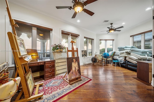 sitting room featuring crown molding and dark wood-type flooring