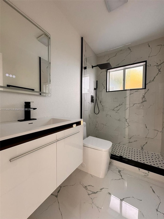 bathroom featuring vanity, a tile shower, and toilet