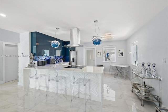 1410 S 22nd Ave, Hollywood, FL 33020 - kitchen featuring island range hood, stainless steel refrigerator with ice dispenser, light marble finish floors, and a kitchen breakfast bar