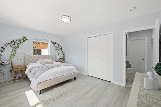 1410 S 22nd Ave, Hollywood, FL 33020 - bedroom with light wood-style flooring, a closet, and baseboards