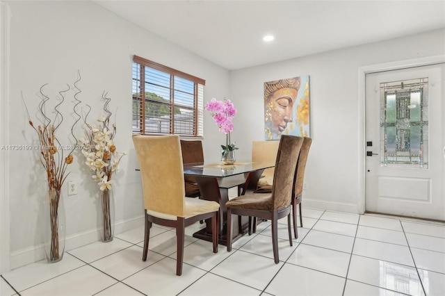 dining area featuring light tile patterned flooring