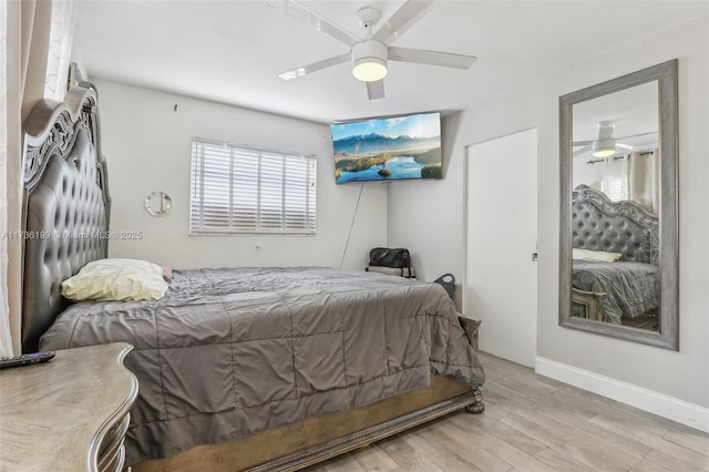 bedroom with ceiling fan and light wood-type flooring