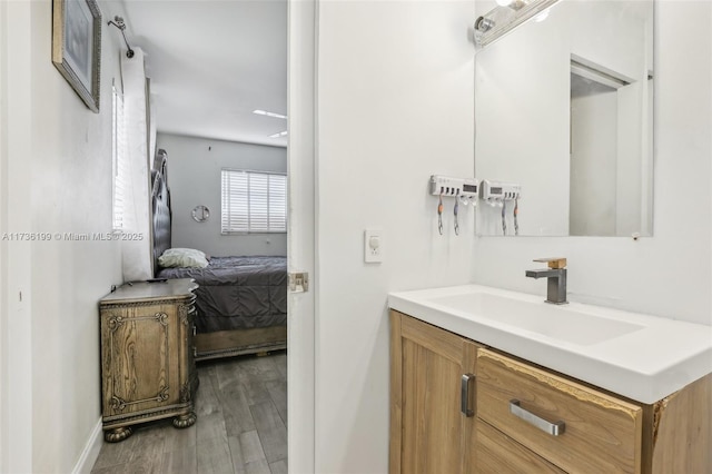 bathroom featuring vanity and wood-type flooring