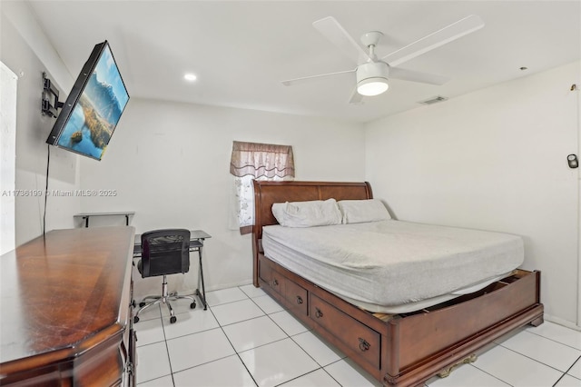 tiled bedroom featuring ceiling fan