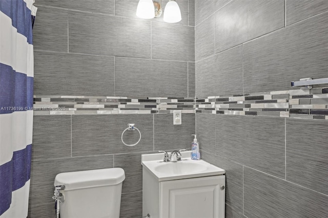 bathroom featuring vanity, toilet, and a shower with shower curtain