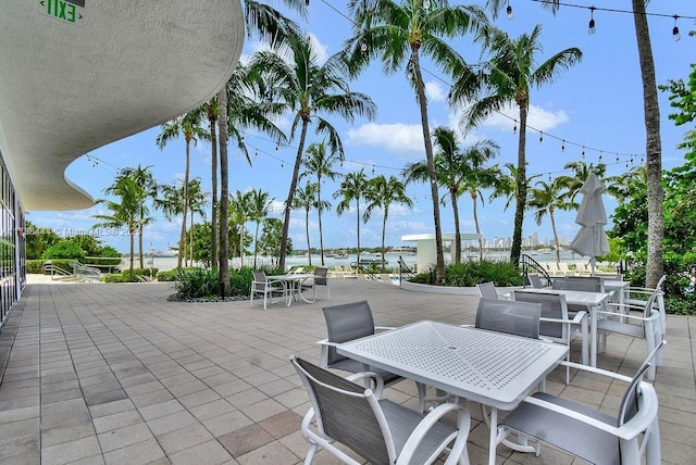 view of patio with a water view