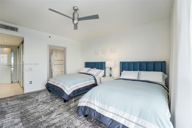 450 Alton Rd Unit 3401, Miami Beach, FL 33139 - bedroom with ceiling fan, wood finished floors, and ensuite bath