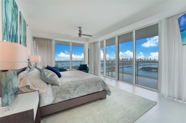 bedroom featuring access to exterior and ceiling fan