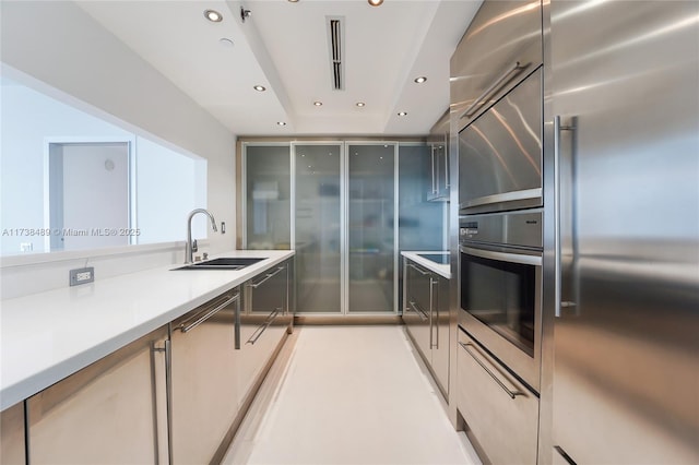 450 Alton Rd Unit 3401, Miami Beach, FL 33139 - kitchen with stainless steel appliances, a sink, recessed lighting, and light countertops