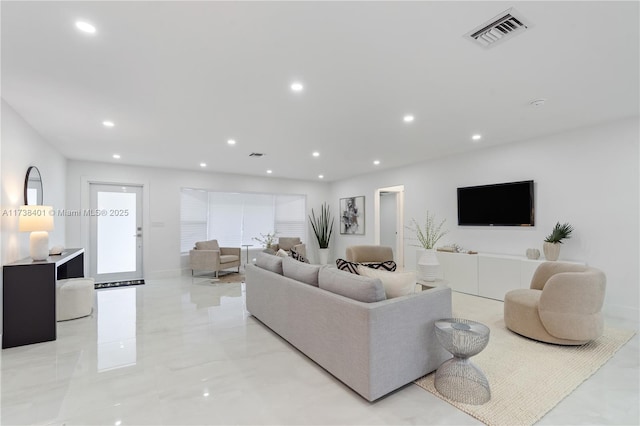 living room featuring recessed lighting and light marble finish flooring