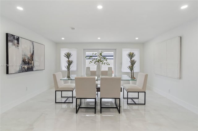 dining room featuring baseboards, recessed lighting, and marble finish floors