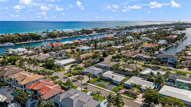 aerial view of residential area featuring a large body of water
