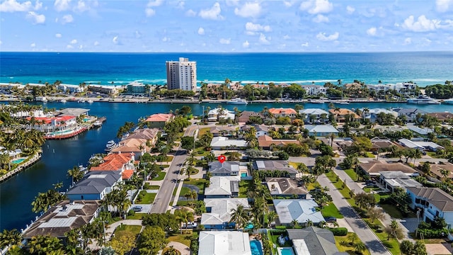 aerial view of residential area featuring a nearby body of water