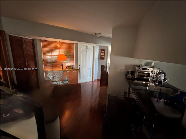 dining space featuring wood-type flooring