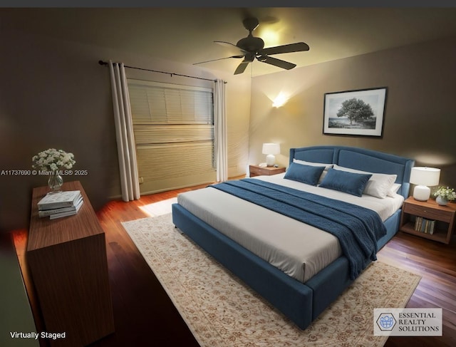 bedroom featuring ceiling fan and wood finished floors